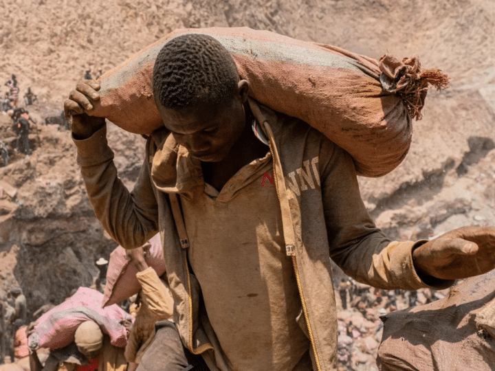 An artisanal miner carries a sack of ore at the Shabara artisanal mine near Kolwezi, DRC, on Oct. 12, 2022.