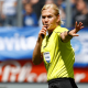 Female referree, Bibiana Steinhaus, blows her whistle and motions for the game to pause at the league match between MSV Duisburg and FSV Zwickau in Duisburg in May 2017