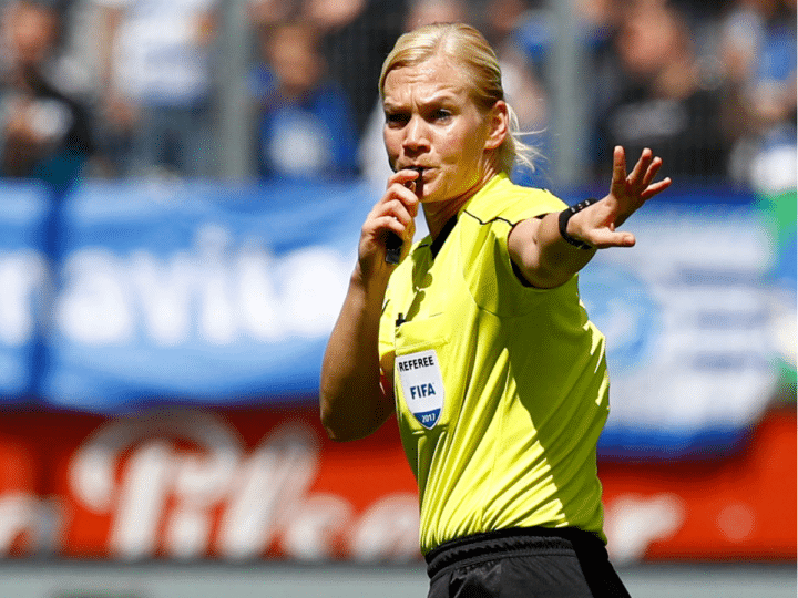 Female referree, Bibiana Steinhaus, blows her whistle and motions for the game to pause at the league match between MSV Duisburg and FSV Zwickau in Duisburg in May 2017