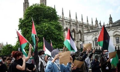 Palestine flags wave in front of King's College Chapel Cambridge. ICJP letter to universities over surveillance.