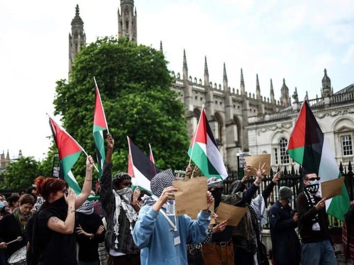 Palestine flags wave in front of King's College Chapel Cambridge. ICJP letter to universities over surveillance.