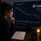 A trader analyzing XLM's price chart