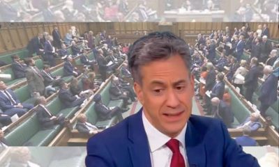 Ed Miliband in front of an image of parliament