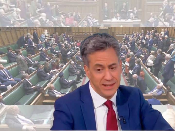 Ed Miliband in front of an image of parliament
