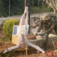 An Israeli soldier takes a sledgehammer to the face of a crucified Jesus Christ statue, which is on the ground. Taken from a BBC News report