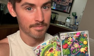 Daniel Benson holding up cards