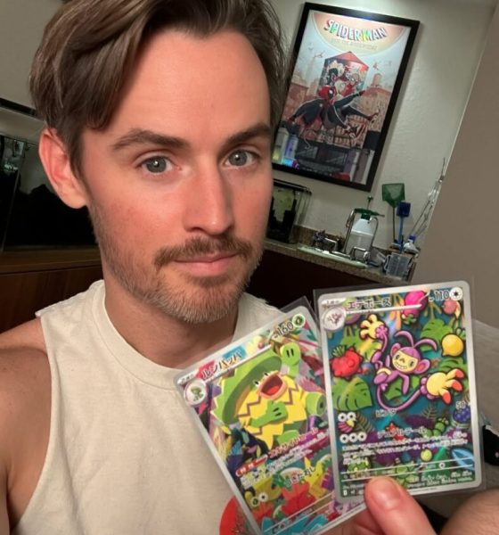 Daniel Benson holding up cards