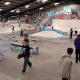 A mock-up photograph of what the Flo Skatepark would look like once opened with graffitti on the walls and young people walking over ramps with their skateboards