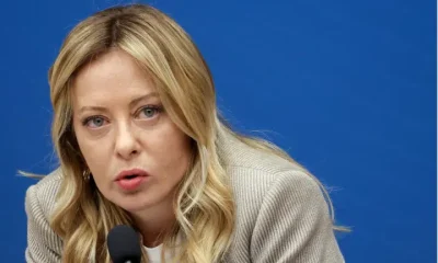 Italy Prime Minister Giorgia Meloni speaking into a microphone