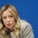 Italy Prime Minister Giorgia Meloni speaking into a microphone