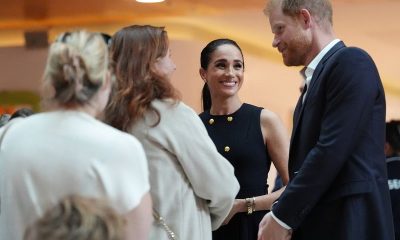 Prince Harry and Meghan arrive in Australia to a muted welcome