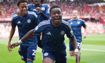Abdul Fatawu celebrates with his Leicester teammates after scoring the winner against Charlton in August 2025. His mouth is open as he runs towards the photographer and his two teammates smile and laugh behind him
