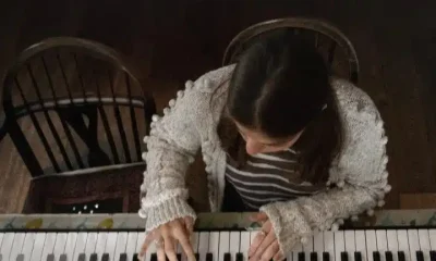 A girl plays a piano in a publicity still from 'Little Rock', from the Dementia Doesn’t Care campaign
