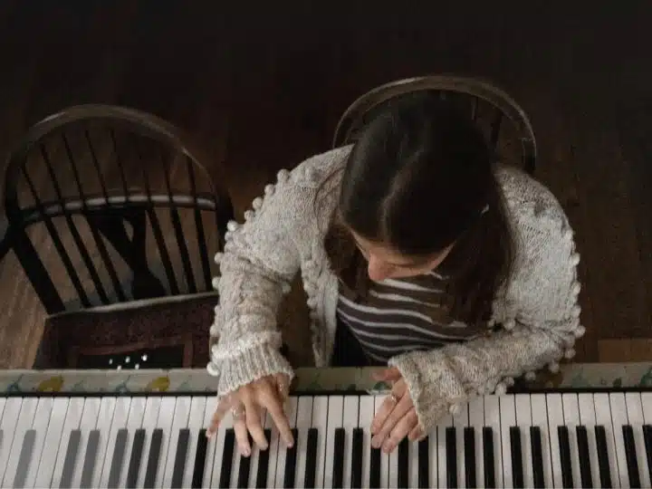 A girl plays a piano in a publicity still from 'Little Rock', from the Dementia Doesn’t Care campaign