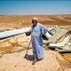 A resident of the Masafer Yatta community looks over his demolished home in 2022
