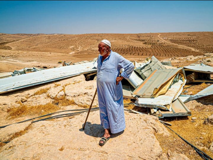 A resident of the Masafer Yatta community looks over his demolished home in 2022
