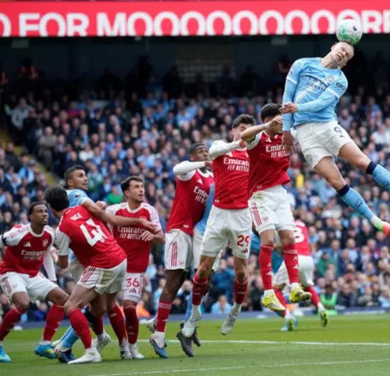 Manchester City's Erling Haaland heads the ball during the English Premier League soccer match between Manchester City and and Arsenal, in Manchester, England, Sunday, April 19, 2026.