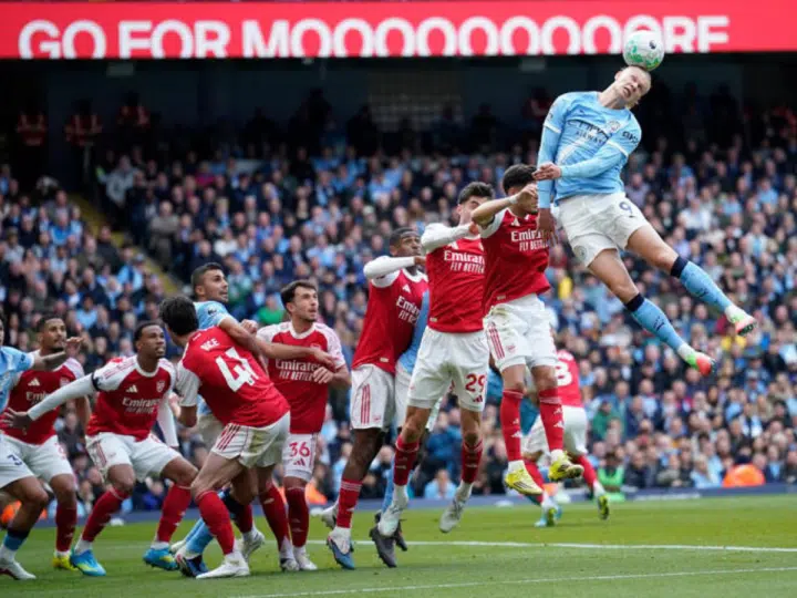 Manchester City's Erling Haaland heads the ball during the English Premier League soccer match between Manchester City and and Arsenal, in Manchester, England, Sunday, April 19, 2026.