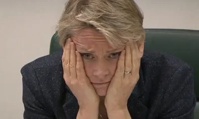 Yvette Cooper with her face in her hands, looking worried