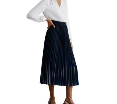 A woman wearing a white blouse and blue midi skirt with black slingbacks