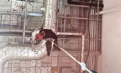 A person abseils into the UAV Tactical Systems factory in Leicester