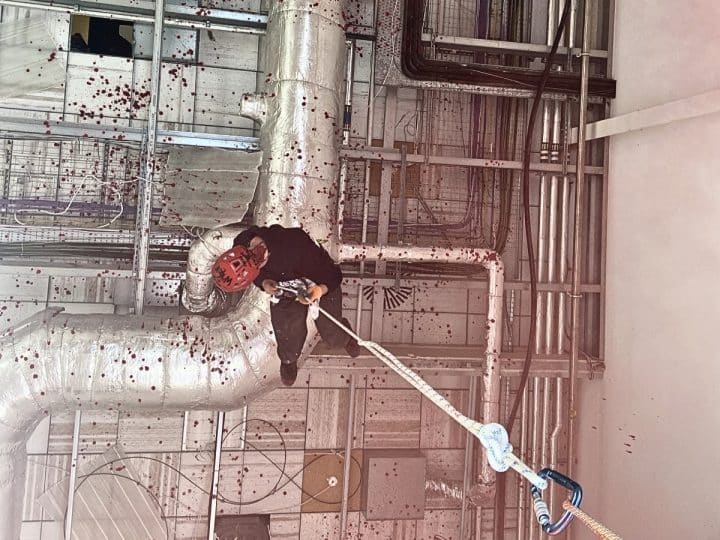 A person abseils into the UAV Tactical Systems factory in Leicester