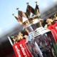 A close-up of the regal looking Premier League trophy that has 'Premier League' engraved into the silver at the front and tassels hanging from the sides