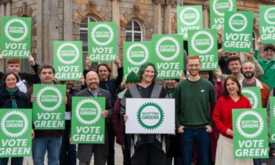 Scottish Greens holding placards