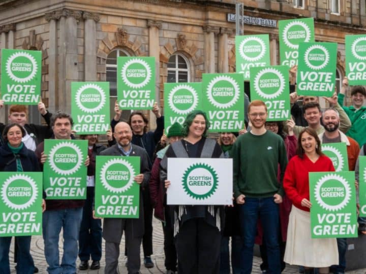 Scottish Greens holding placards