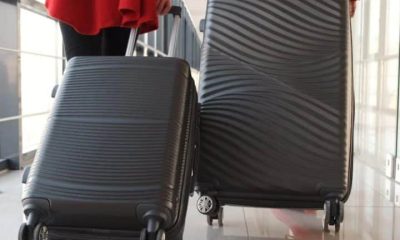 People dragging suitcases More young Britons leaving the UK