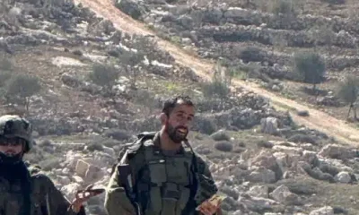 Israeli occupation soldiers photographed against a backdrop of rocky hills in April 2026