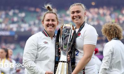 Marlie Packer and Rosie Galligan pose for a photograph holding the RWC trophy