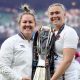 Marlie Packer and Rosie Galligan pose for a photograph holding the RWC trophy