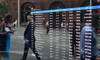 Aussie hits four-year high as banks, miners drag shares