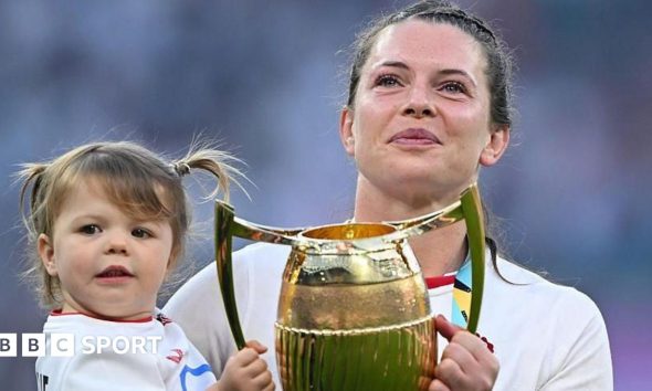Lark Atkin-Davies and Abbie Ward with children on the Allianz Stadium pitch