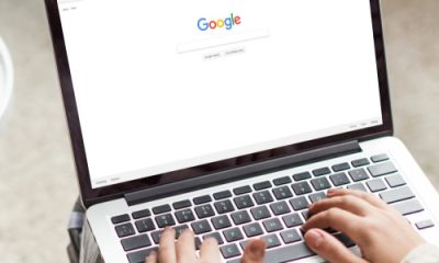 stylish professional woman is ready to Google something on her laptop