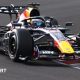 Red Bull's Max Verstappen drives across a kerb during the 2026 Japanese Grand Prix