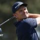 Justin Rose tees off