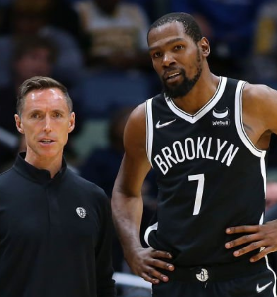 Brooklyn Nets head coach Steve Nash (L) and Kevin Durant (R) chat during a game against the New Orleans Pelicans at the Smoothie King Center on November 12, 2021.