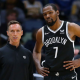 Brooklyn Nets head coach Steve Nash (L) and Kevin Durant (R) chat during a game against the New Orleans Pelicans at the Smoothie King Center on November 12, 2021.