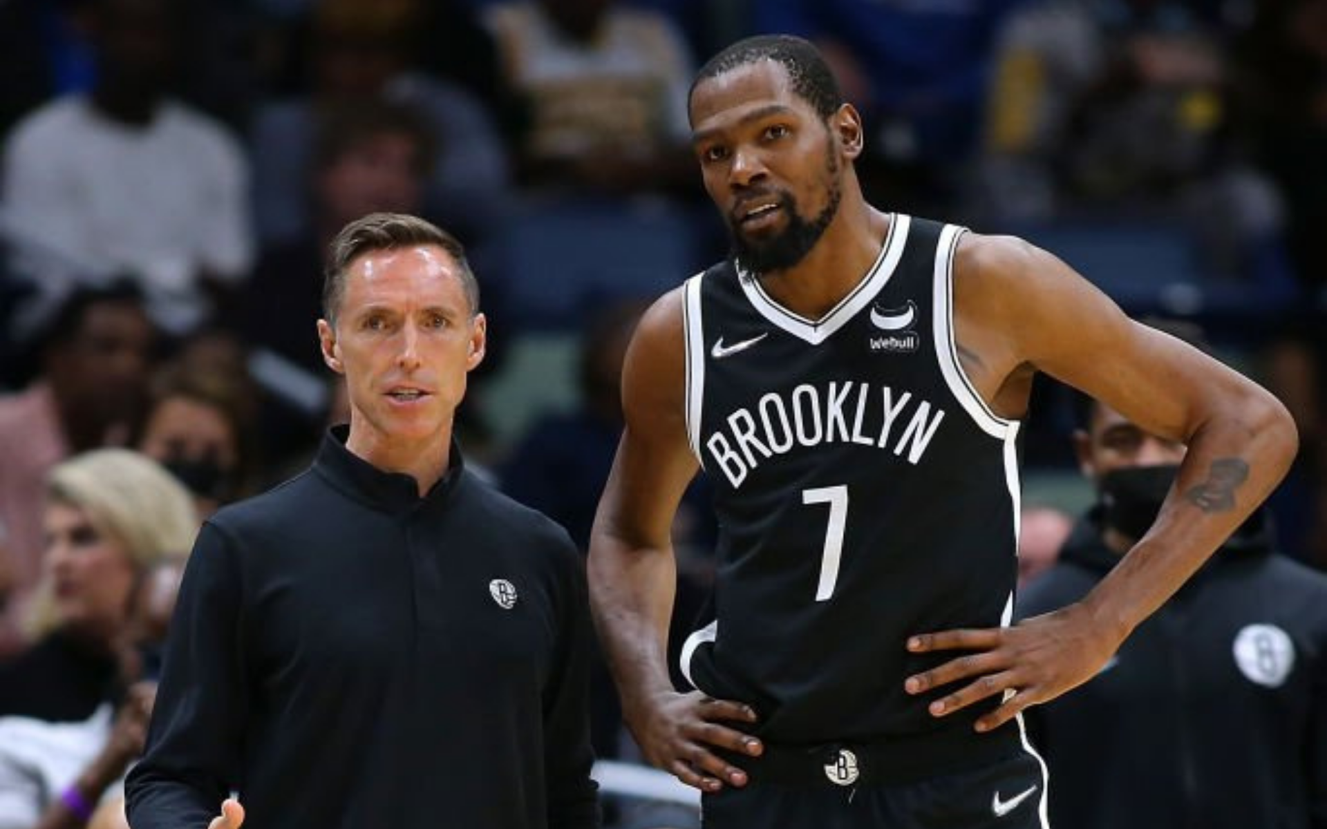 Brooklyn Nets head coach Steve Nash (L) and Kevin Durant (R) chat during a game against the New Orleans Pelicans at the Smoothie King Center on November 12, 2021.