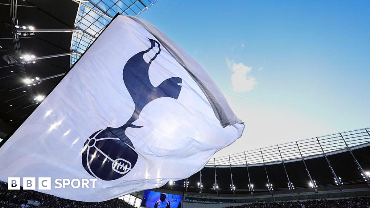 A white flag with a Tottenham Hotspur crest on it