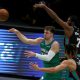 Dallas Mavericks star Luka Doncic passes the ball against Brandon Clarke, 15, and Justise Winslow ,7, of the Memphis Grizzlies in the second half at American Airlines Center