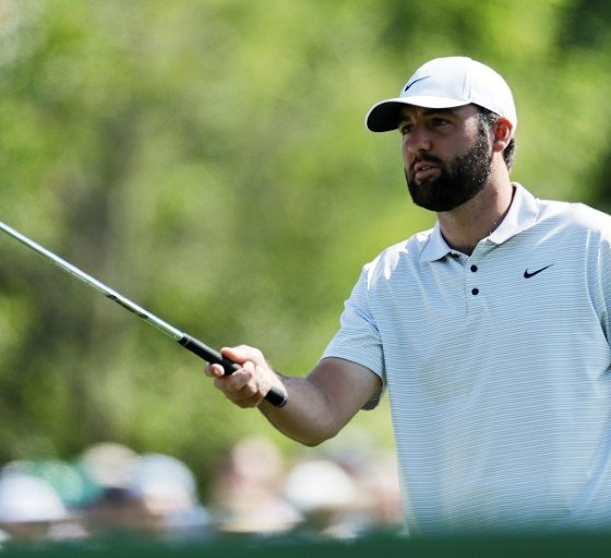 Defending champion Scottie Scheffler prepares to play a shot in the first round of the Masters at Augusta National