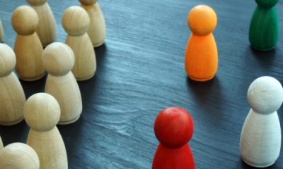 diversity & inclusion concept with wooden and colored figures