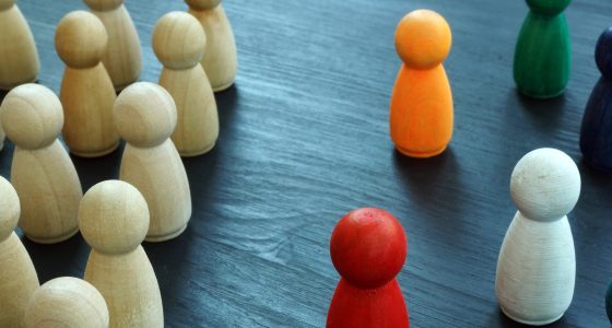 diversity & inclusion concept with wooden and colored figures