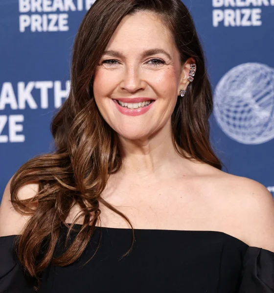 Drew Barrymore wearing Carolina Herrera, Alexis Bittar bag, and Swarovski jewelry arrives at the 11th Annual Breakthrough Prize Ceremony 2025