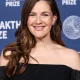 Drew Barrymore wearing Carolina Herrera, Alexis Bittar bag, and Swarovski jewelry arrives at the 11th Annual Breakthrough Prize Ceremony 2025