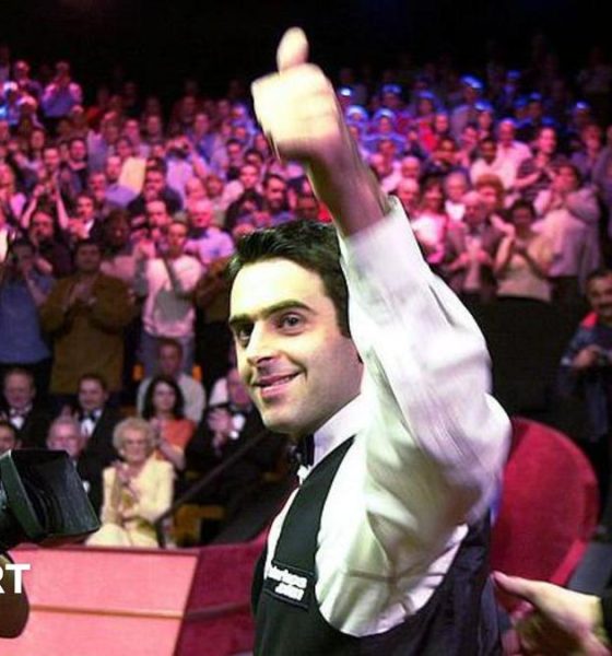 Ronnie O'Sullivan smiles and celebrates with a thumbs-up gesture after winning the 2001 World Championship