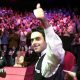 Ronnie O'Sullivan smiles and celebrates with a thumbs-up gesture after winning the 2001 World Championship